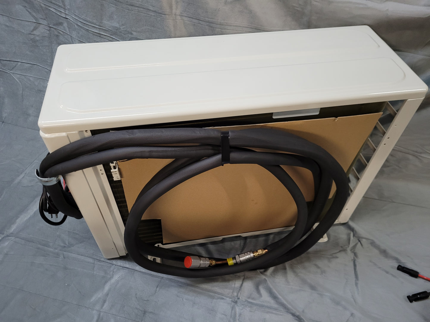 The pre-charged line set is attached to the outside unit.